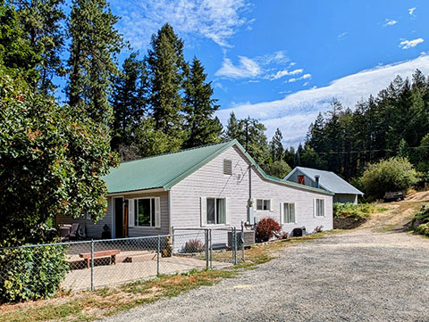 PRIVATE RURAL SETTING ON PAVED ROAD WITH A SHOP!