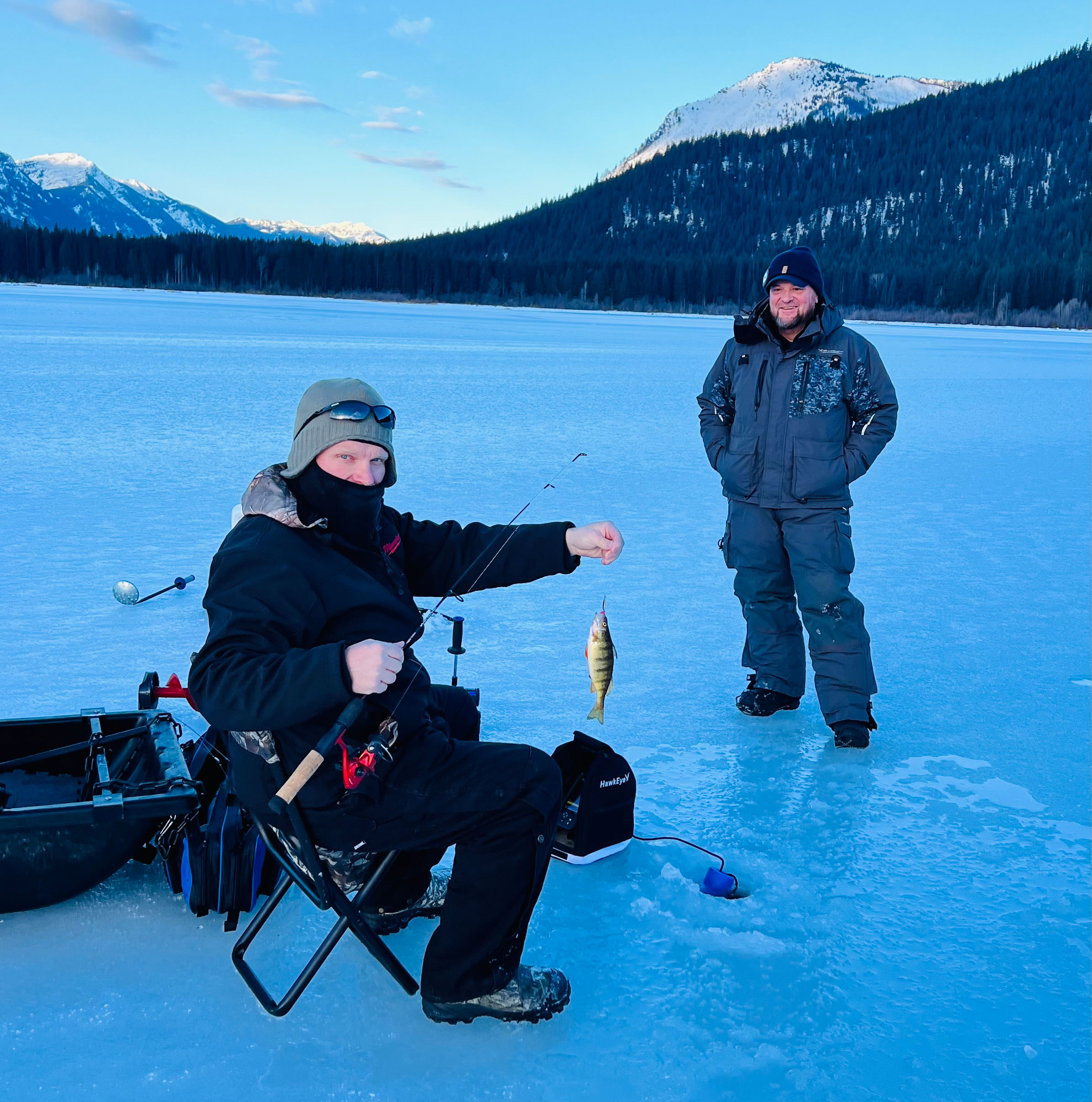 Ice anglers at Fish Lake testing early-season ice conditions for perch fishing