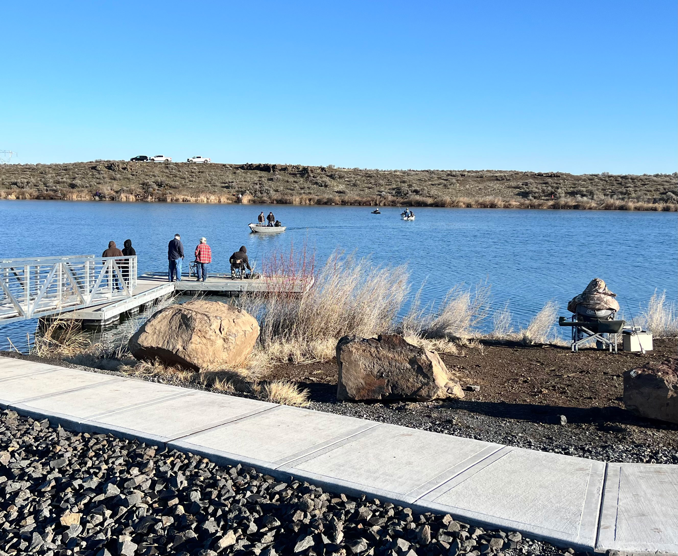 Anglers fishing at Burke Lake during the March 1st opening day, enjoying early-season trout action.