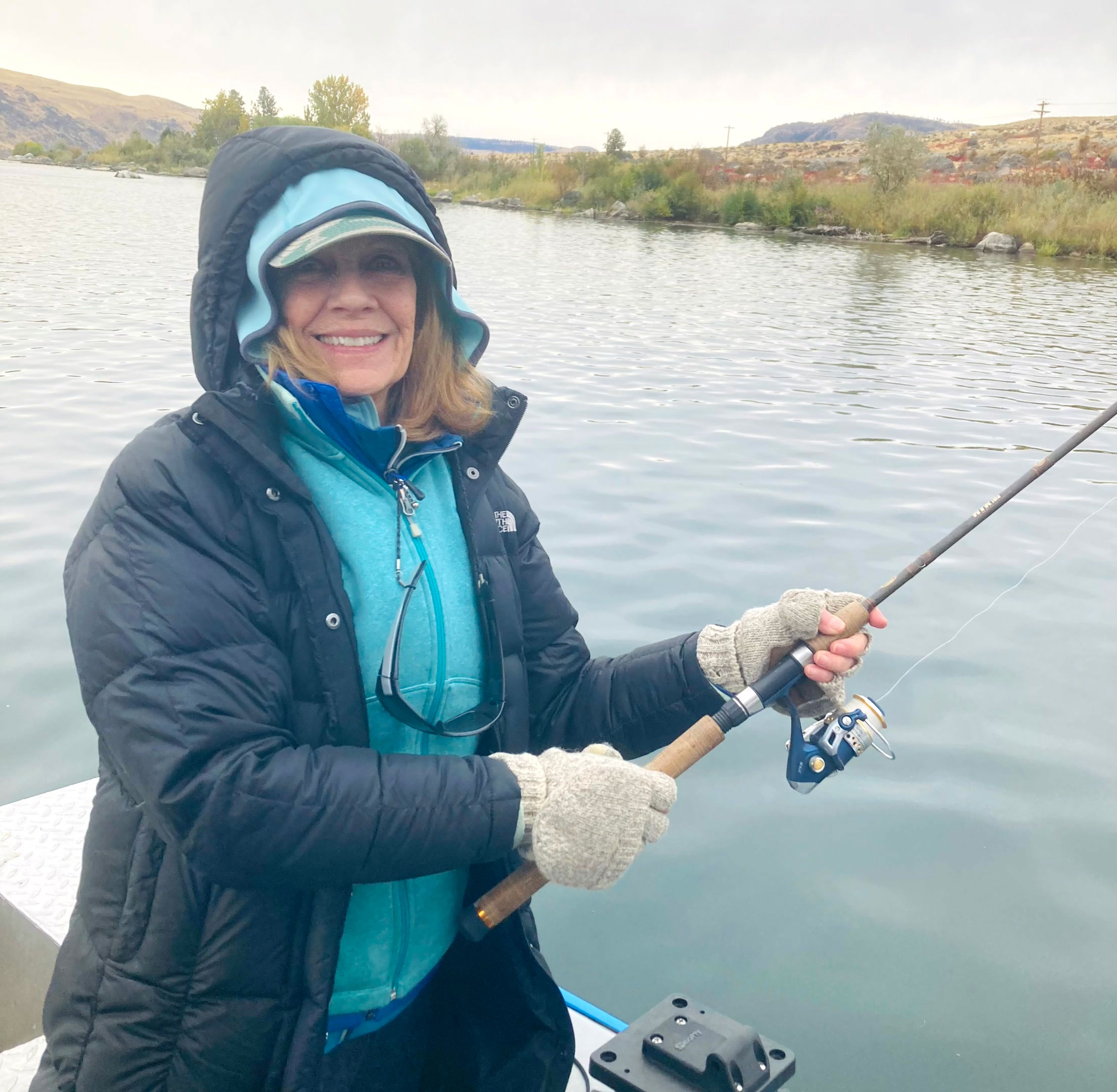 Eileen casting a bobber and jig above Coyote Rocks, enjoying a day of steelhead fishing on the Columbia River.