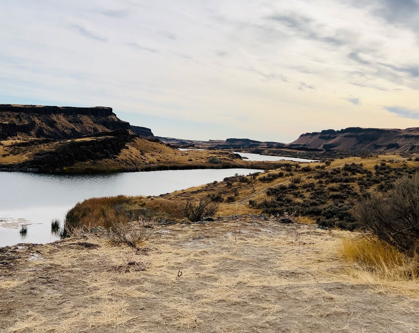 A view of Corral Lake with Blythe Lake in the distance, part of the scenic Seep Lakes Area in Washington.