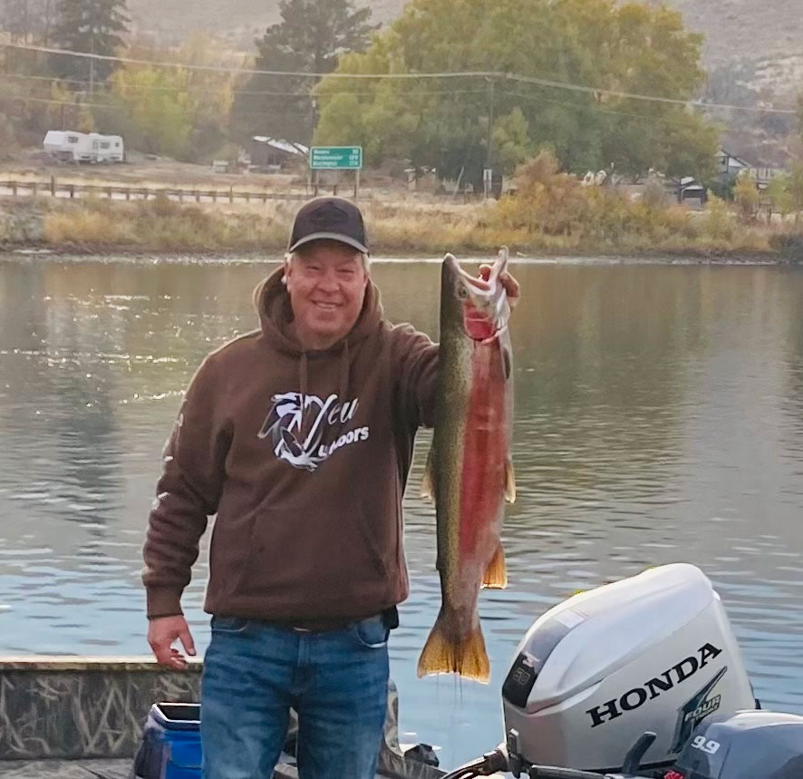 Randy Cole holding a large steelhead caught near Pateros, showcasing a successful day on the Columbia River.