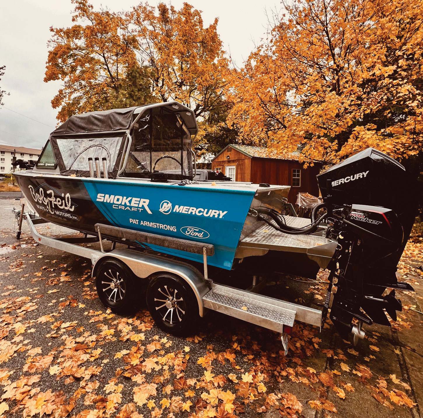 The Smoker Craft Phantom boat with its full cover on, ready for winter fishing adventures.