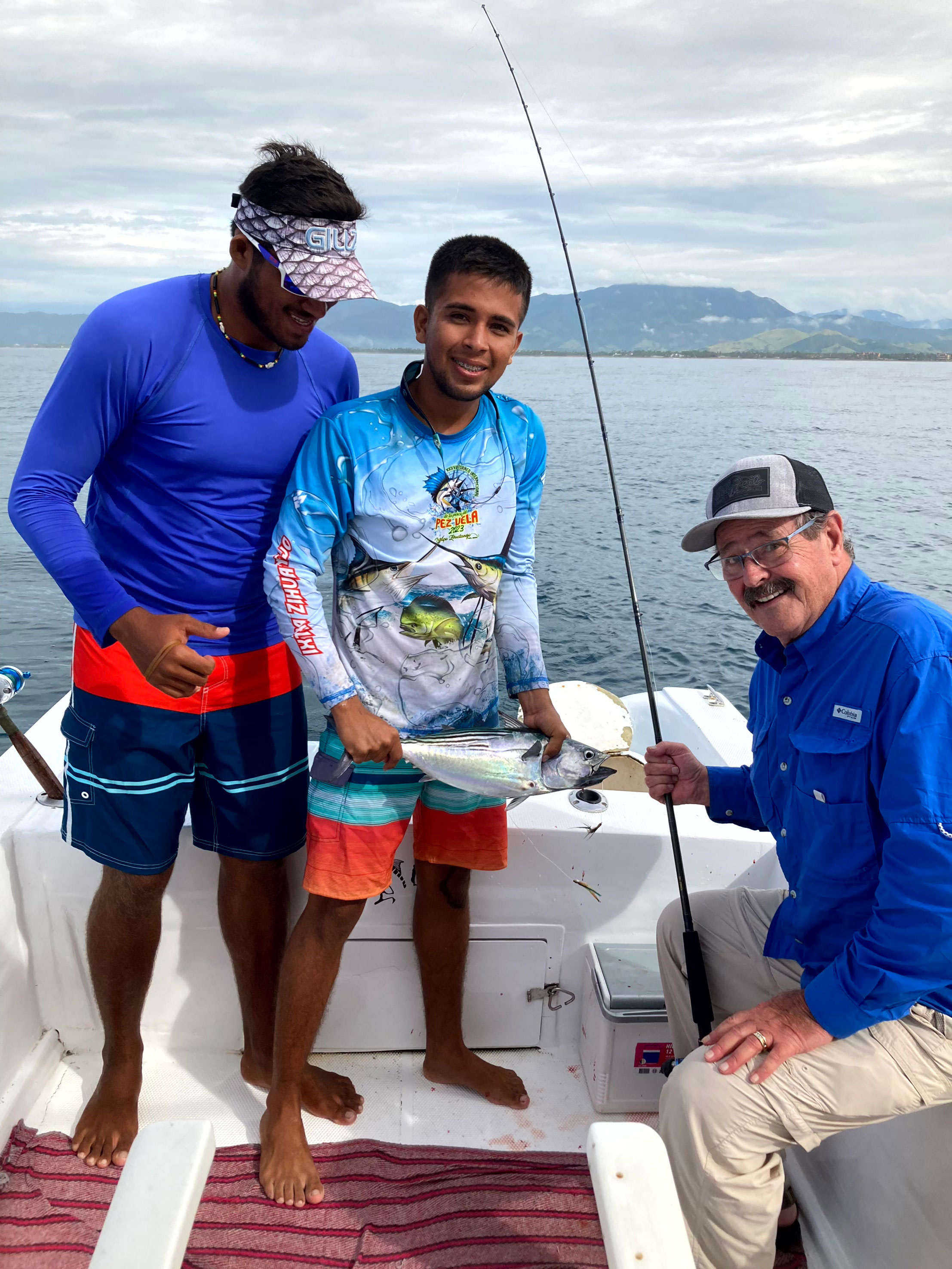 Aboard a super panga in Zihuatanejo, Mexico, showcasing the day’s bonito catch with the stunning Pacific Ocean backdrop.