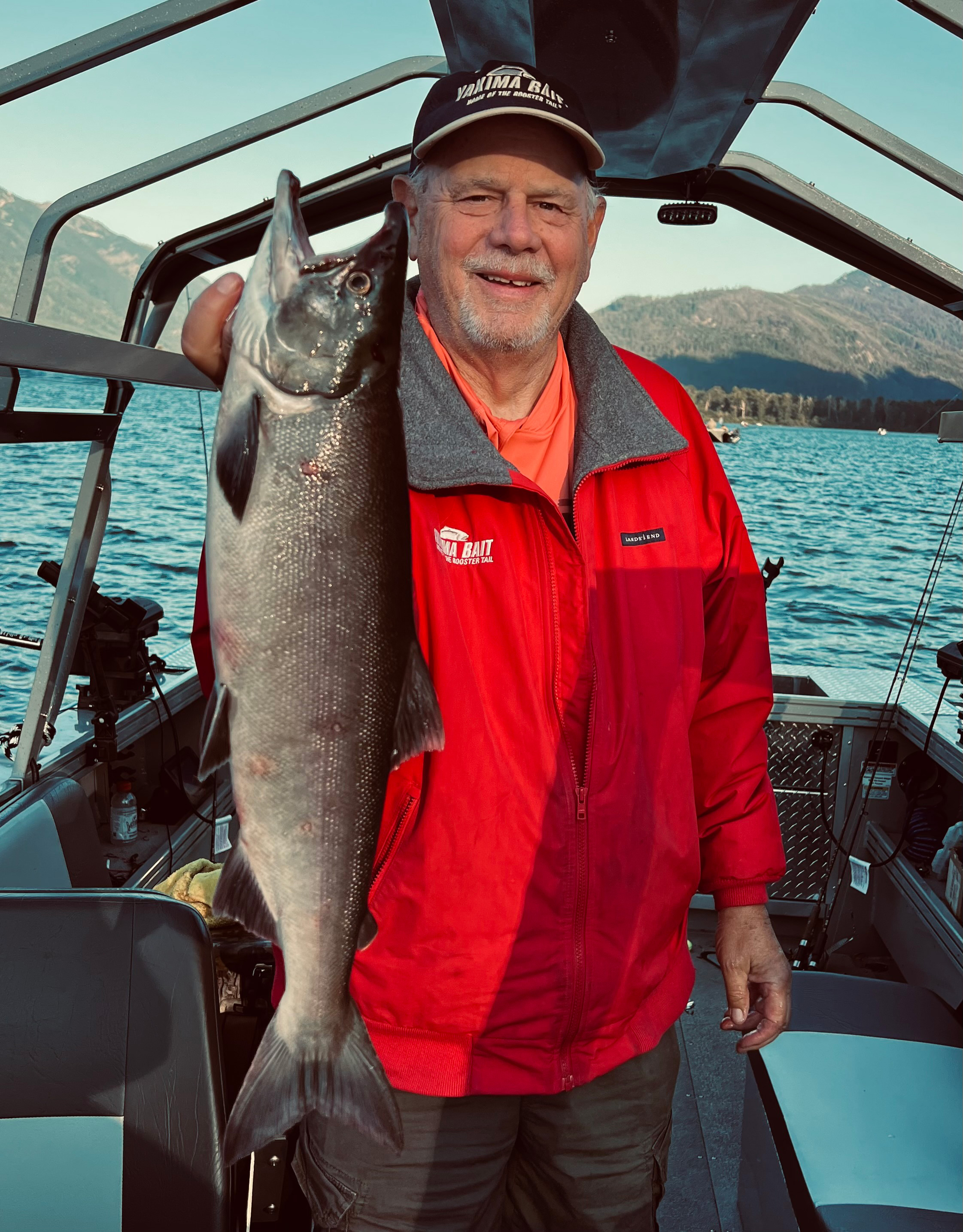 Rob Phillips holding a sockeye salmon caught on Lake Wenatchee, showcasing the success of the fishing trip.