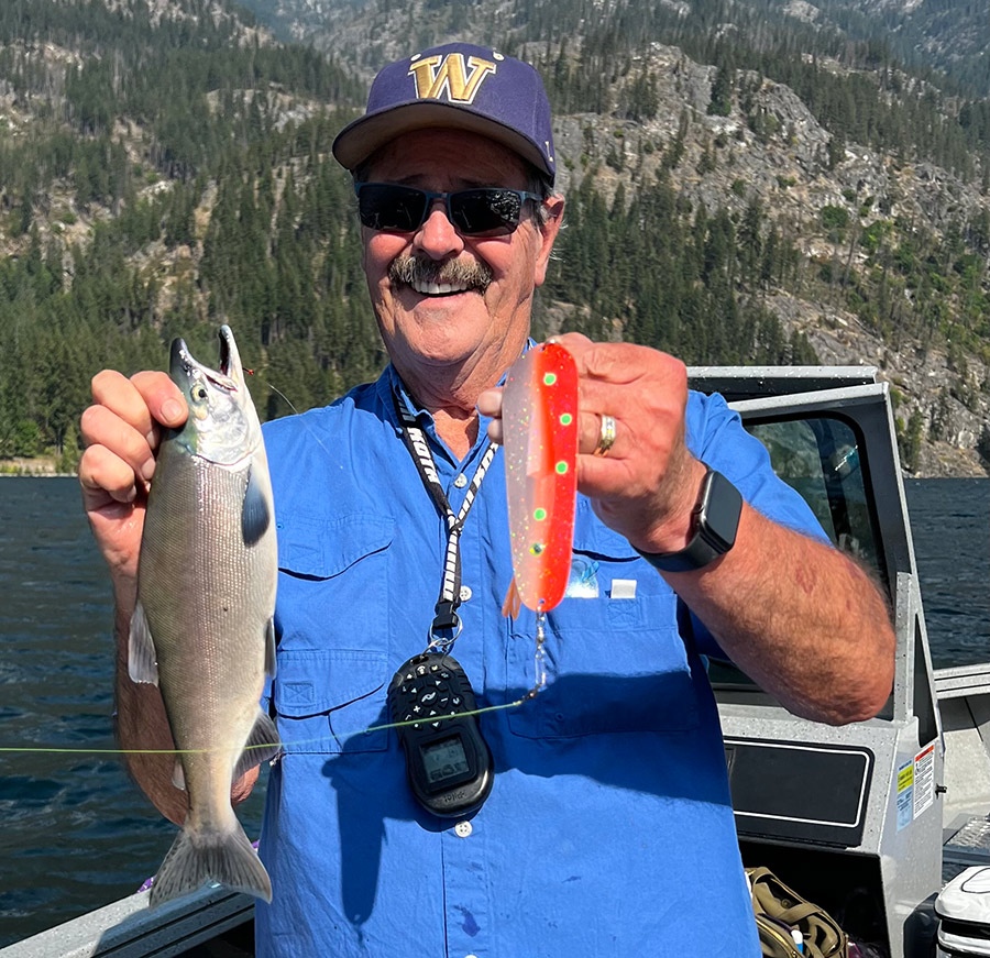 Dave Graybill with a kokanee he caught and the Kokabow combo.