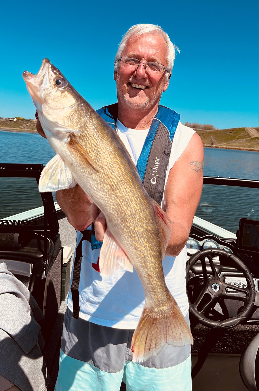 Mike Wren with one of the walleye he landed.