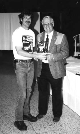 Neil Hansen receives the Lloyd Scott Memorial award from Orville Moe